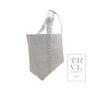 White tote bag with subtle pink design on a white background
