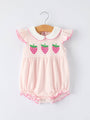 Pink baby romper with strawberry design on a white background