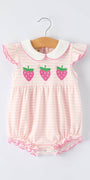 Pink baby romper with strawberry design on a white background