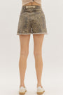 Leopard print denim shorts worn by a person on a white background