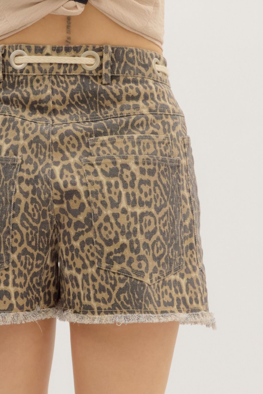 Leopard print shorts on a plain background
