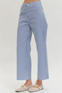 Blue and white striped pants on a plain background