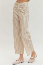 Striped pants worn by a person on a white background