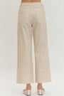 Beige striped pants worn by a person on a white background