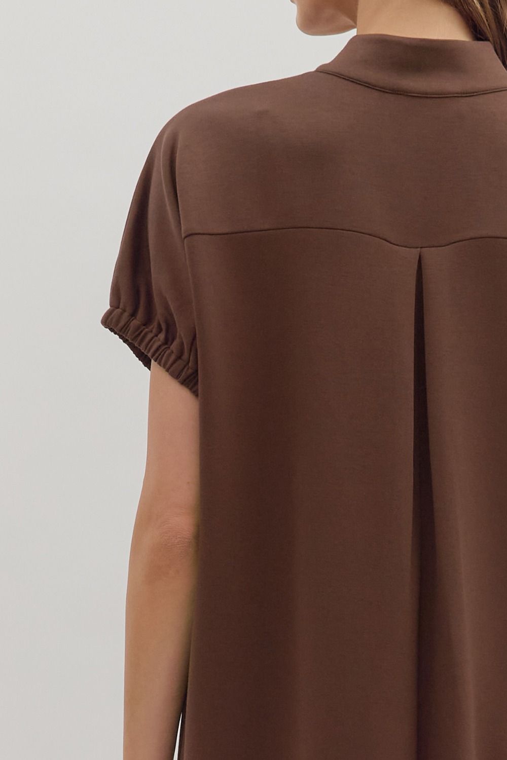 women wearing a brown short sleeve midi dress