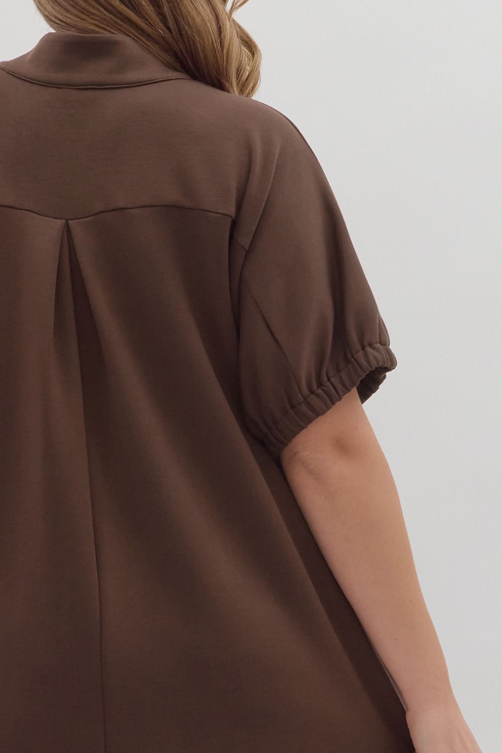 women wearing a brown short sleeve midi dress