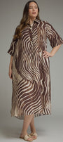 A woman modeling a brown and beige zebra-print midi shirt dress with short sleeves, a button-up front, and a relaxed fit, photographed against a neutral gray studio background.