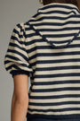 Navy and white striped sweater with a hood on a neutral background