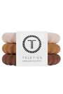 Three Teleties hair tie bands stacked vertically with a white paper label in the center. The bands are in three different neutral shades: a light cream, a warm camel tan, and a medium brown.
