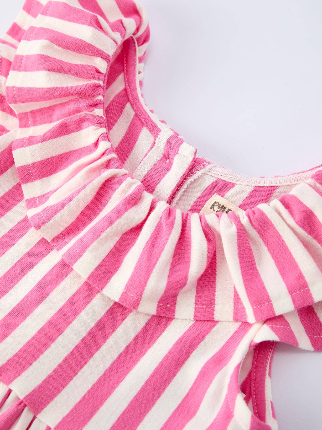 Pink and white striped dress on a light gray background