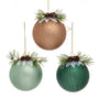 Three textured Christmas tree ornaments in metallic bronze, sage green, and forest green, each decorated with pine needles, small pinecones, and white faux snow, hanging against a white background.