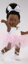 Doll in a ballet outfit with a pink tutu and white shoes on a plain background