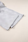 Folded fabric with a geometric pattern on a beige background