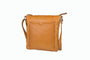 Tan leather crossbody bag on a white background