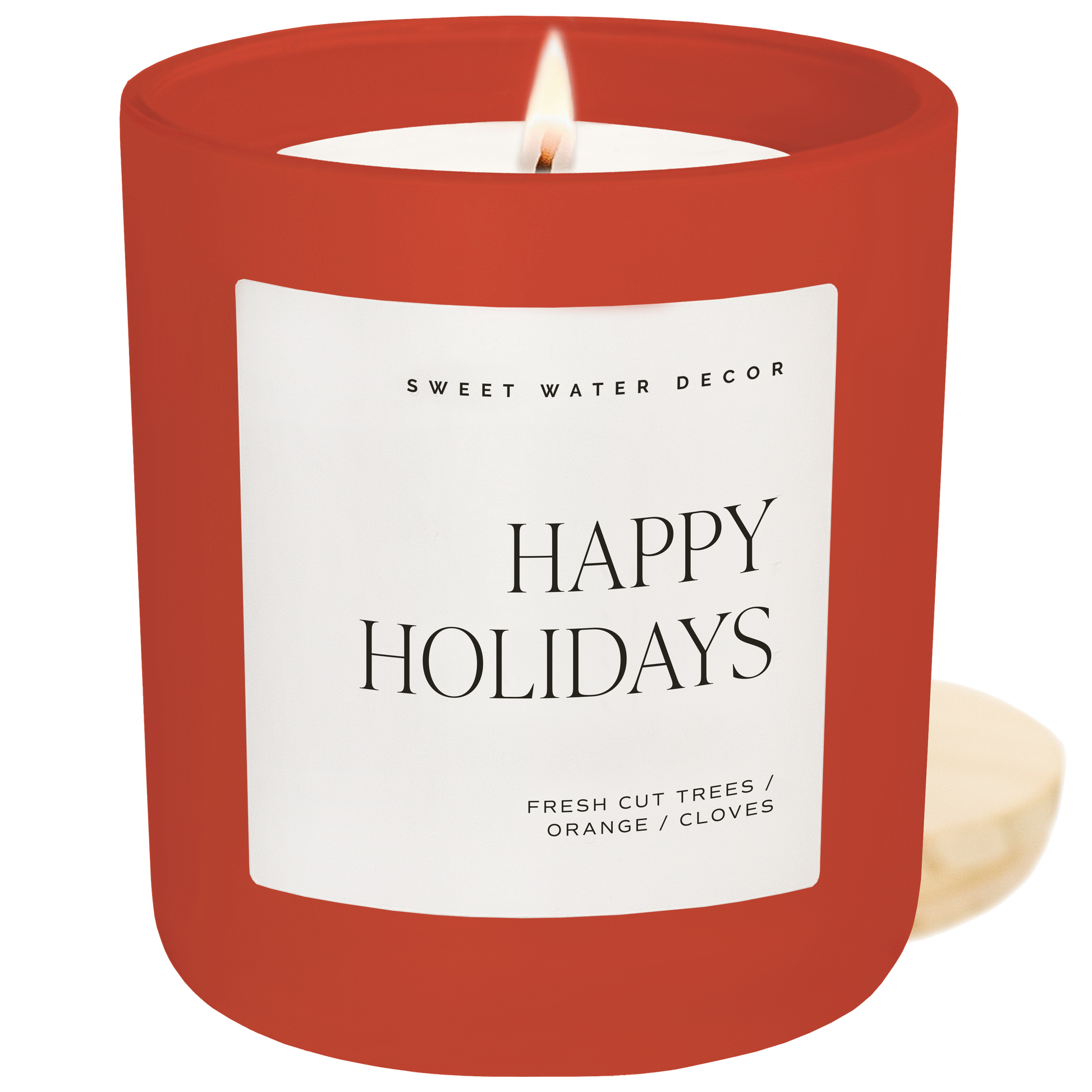 Red candle with a 'Happy Holidays' label on a white background