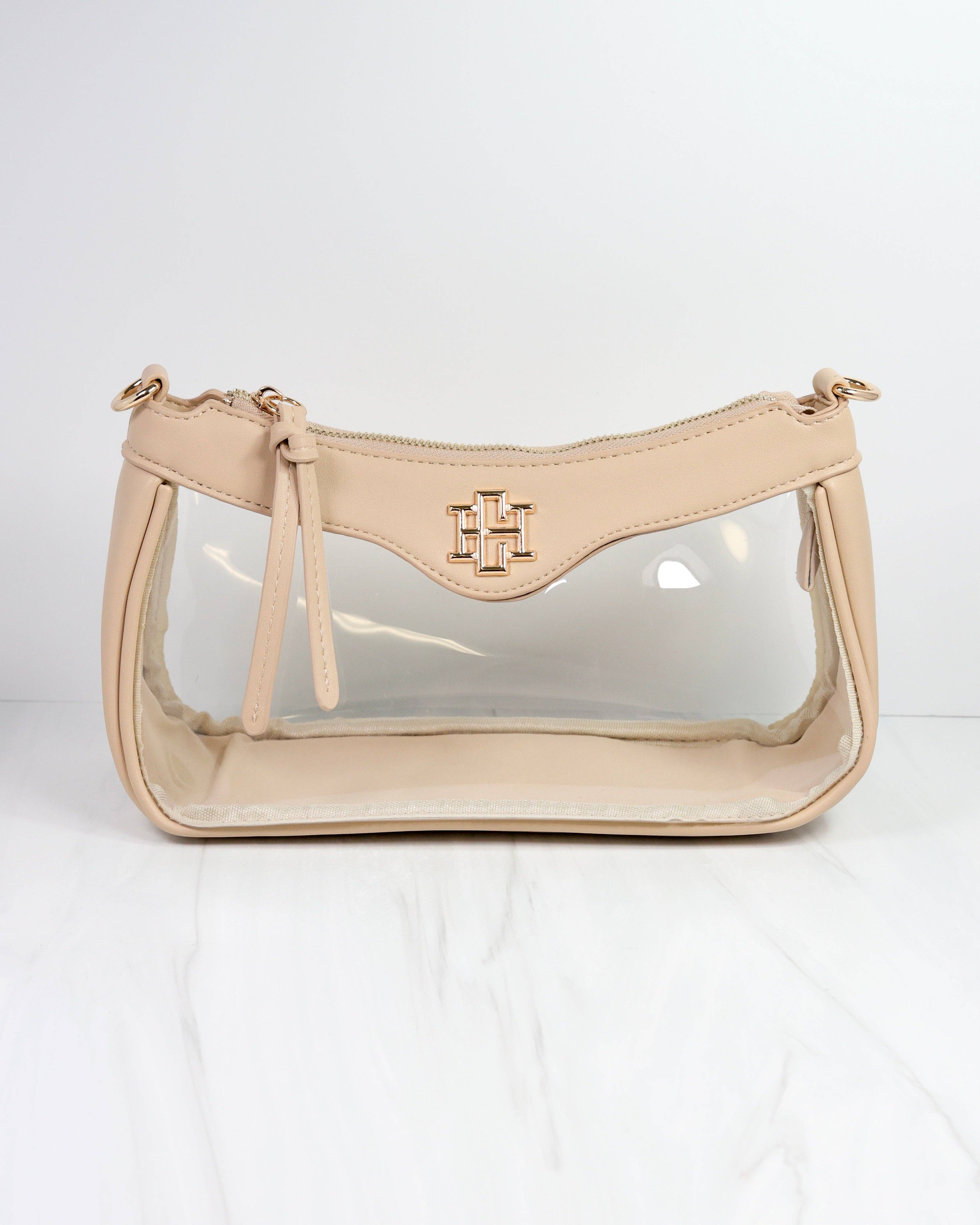 Beige handbag with clear front section on a white background