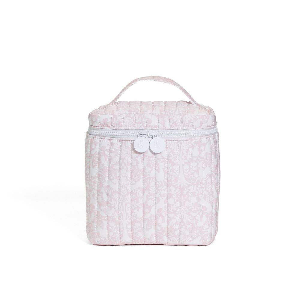 Pink textured lunch box with a white handle on a white background