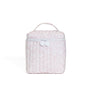 Pink textured lunch box with a white handle on a white background