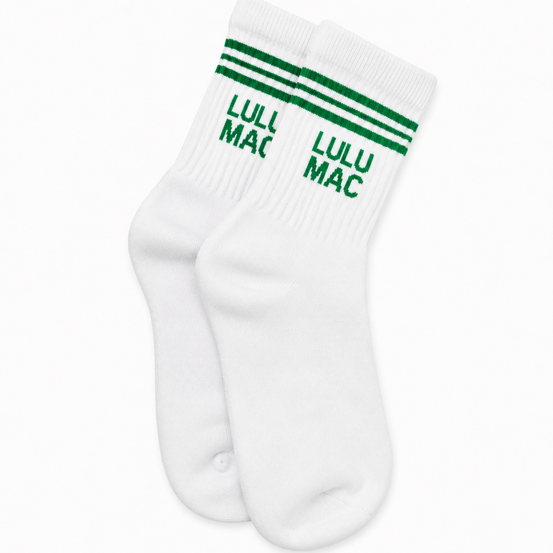 White crew socks with green stripes and Lulu Mac logo, single pair