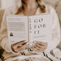 Open book pages showing 'Go For It' title and devotional text with hands