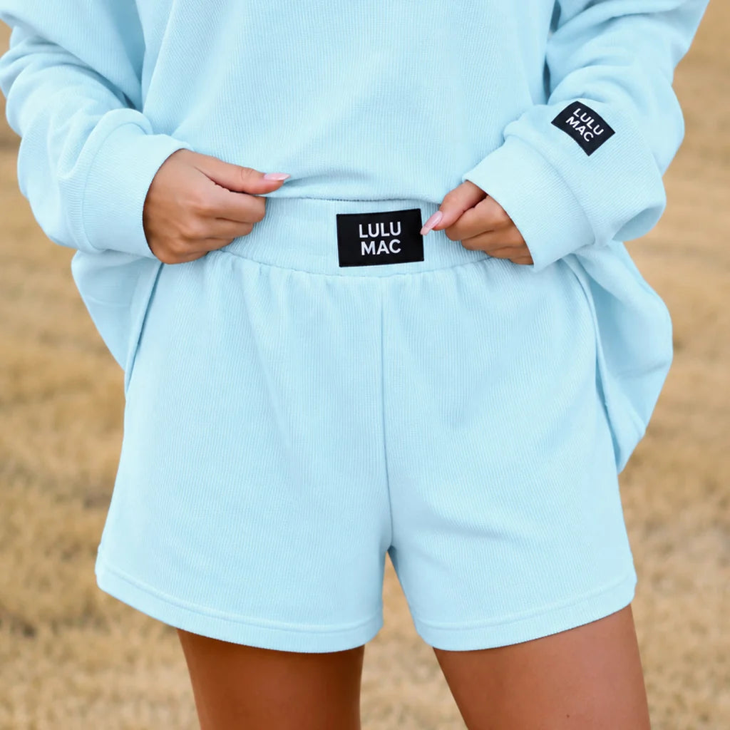 Ice blue waffle knit shorts with elastic waistband and LULU MAC logo patch