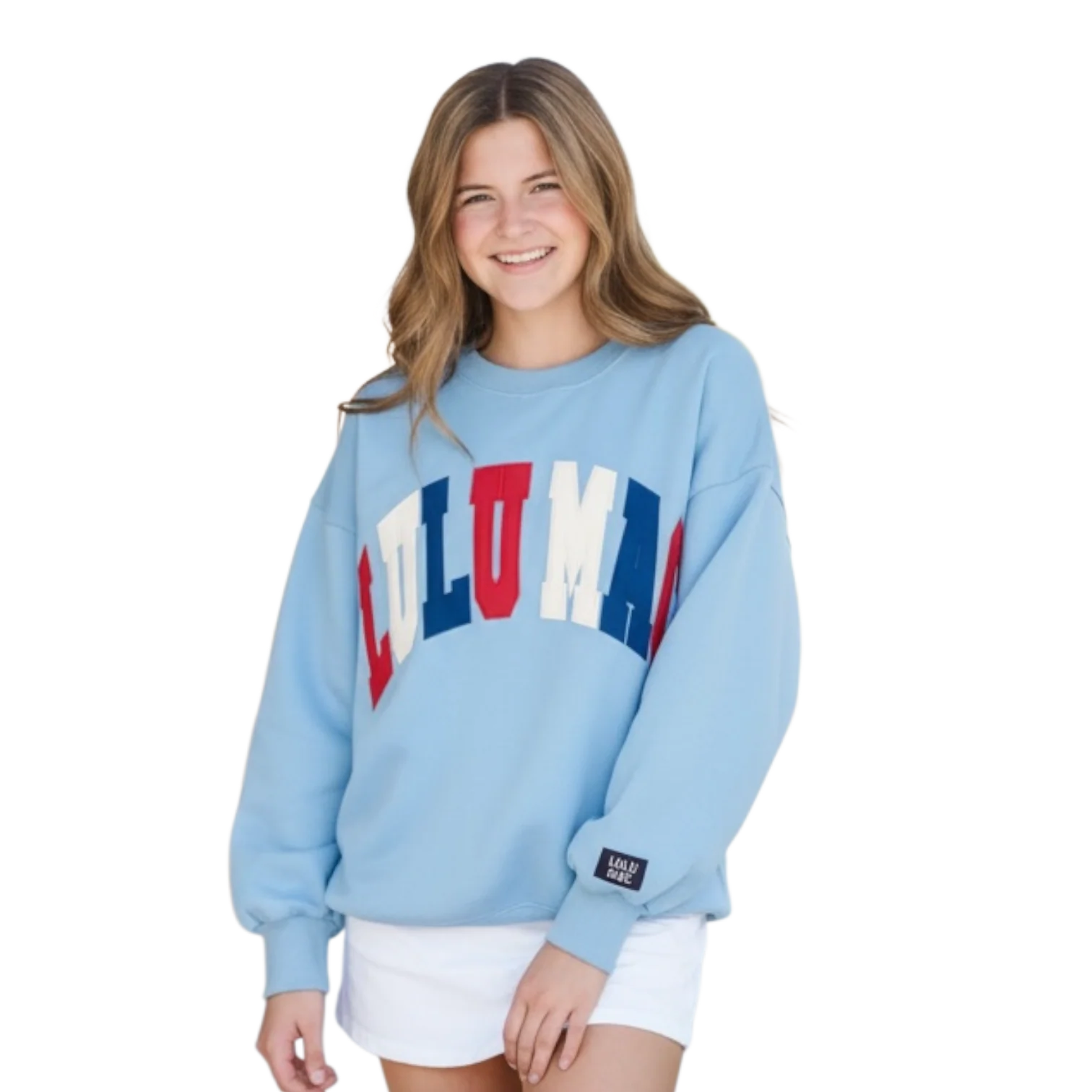 Woman wearing a light blue sweatshirt with colorful text on a white background