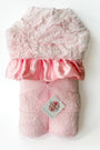 Pink plush toy with a satin bow on a white background