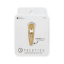 Gold hair clip on a Teleties packaging with text about seamless tip feel.