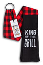Red and black checkered towel with a black towel labeled 'King of the Grill' on a white background