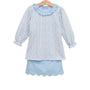 A light blue and white vertically striped long-sleeve blouse with a ruffled collar and scalloped edges, shown on a wooden hanger against a plain white background.