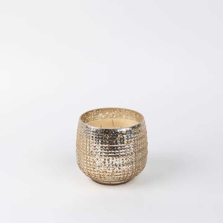 Decorative candle holder with textured surface on a white background
