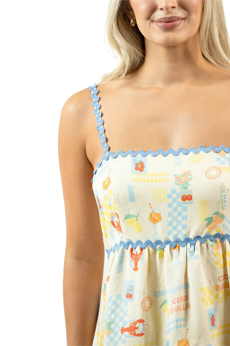 Woman wearing a patterned dress with a white background