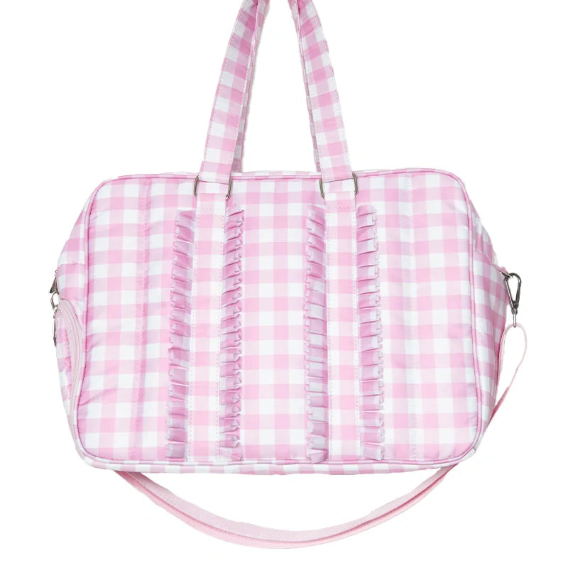 Pink gingham patterned bag on a white background