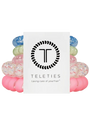 Set of colorful hair ties with a Teleties branded card on a white background