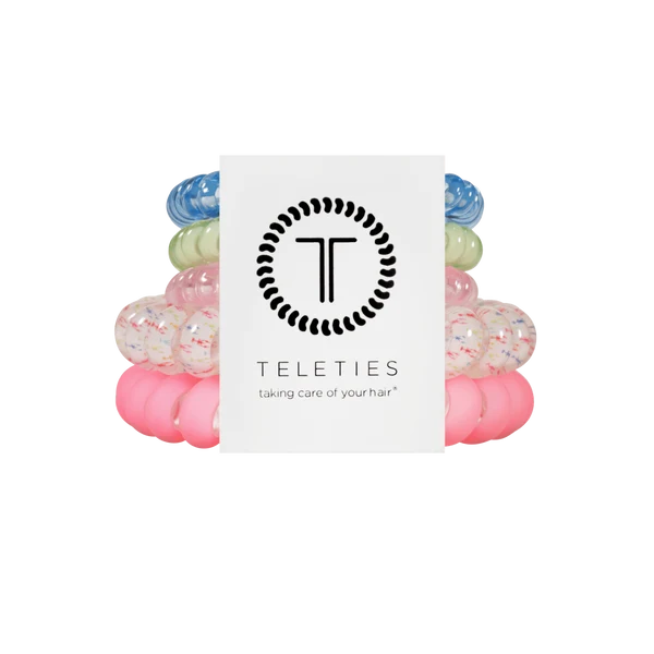 Set of colorful hair ties with a Teleties branded card on a white background