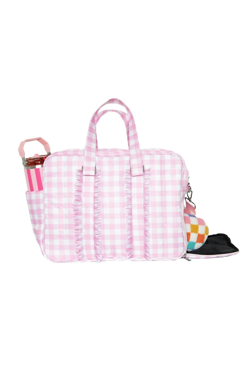 Pink checkered bag with colorful accents on a white background