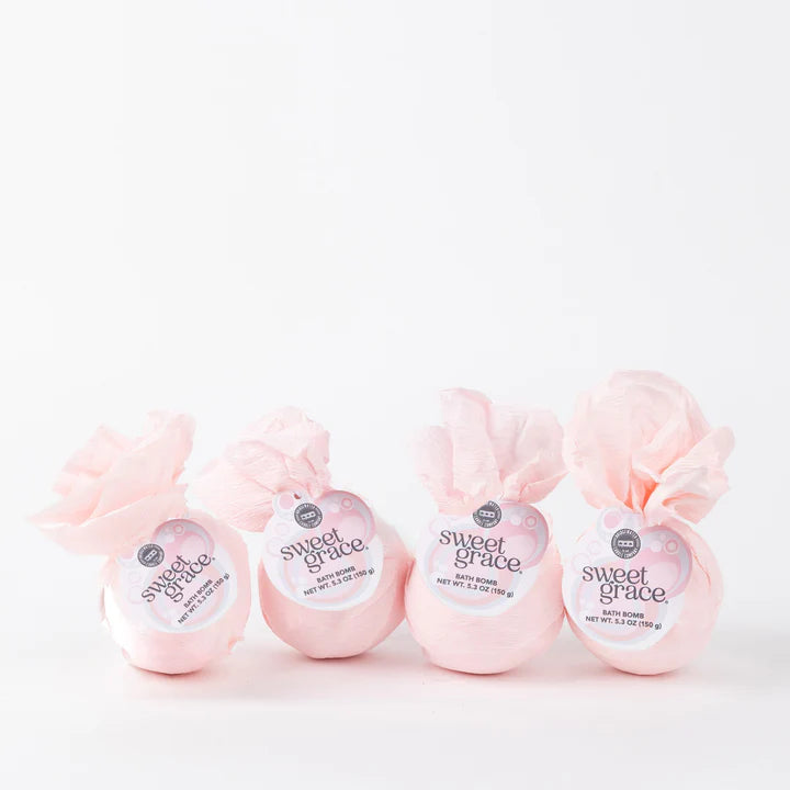 Four pink bath bombs labeled 'sweet grace' on a white background