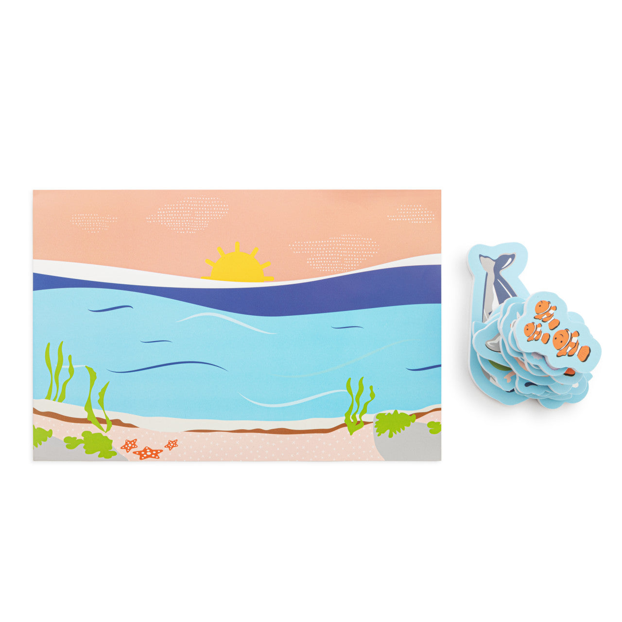 Illustrated beach scene with a whale and coral, next to a whale-shaped object with text.