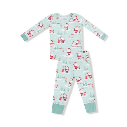Children's Christmas-themed pajama set with Santa Claus and reindeer on a light blue background.