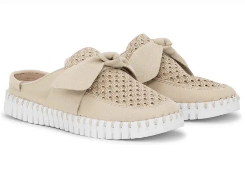 Beige slip-on shoes with bow details on a white background