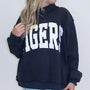 Dark mock neck sweatshirt with large white embroidered letters on the front