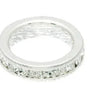 Silver ring with embedded crystals on a white background