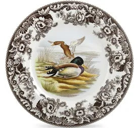 Decorative plate with a duck design and floral patterns