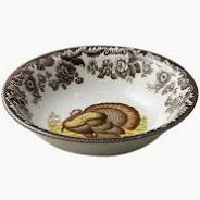 Decorative ceramic bowl with floral patterns on a white background