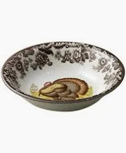 Decorative ceramic bowl with floral patterns on a white background