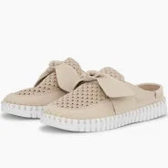Beige slip-on sneakers with white soles on a white background