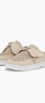 Beige slip-on sneakers with white soles on a white background