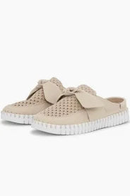 Beige slip-on sneakers with white soles on a white background