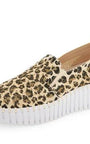 Leopard print slip-on sneaker with a white sole on a white background