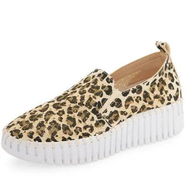 Leopard print slip-on sneaker with a white sole on a white background